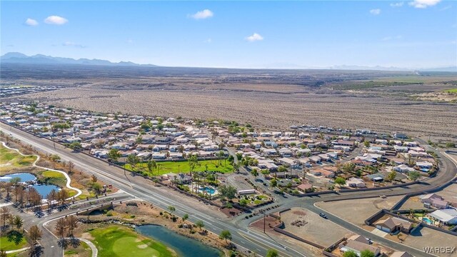 birds eye view of property with a residential view and a water and mountain view