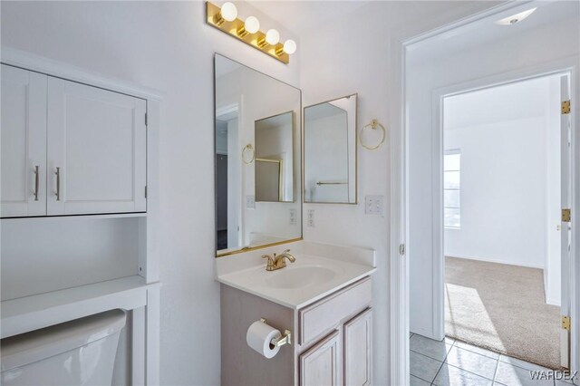 bathroom featuring vanity, toilet, and tile patterned floors