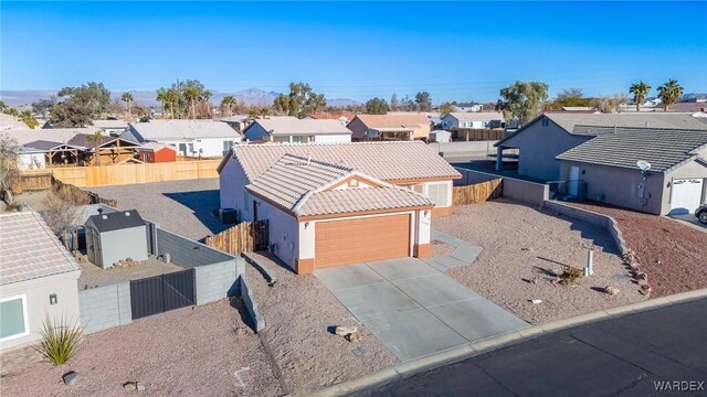 birds eye view of property with a residential view