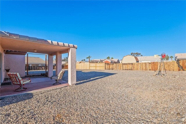 view of yard featuring a patio area and a fenced backyard