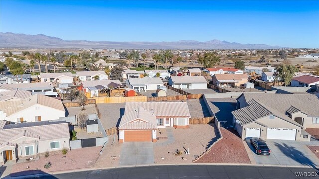 drone / aerial view with a residential view and a mountain view