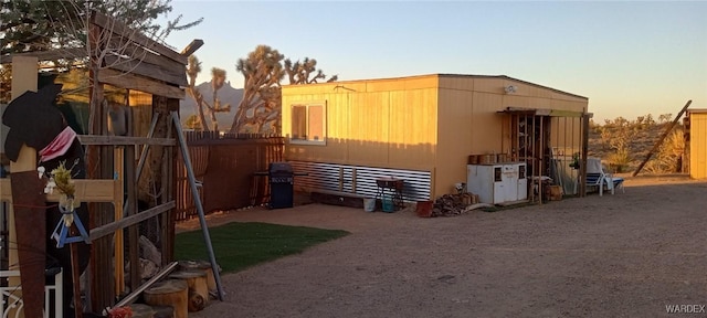 view of outdoor structure at dusk