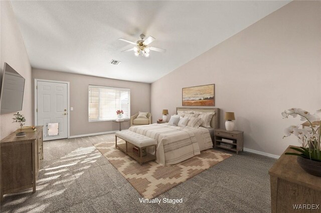 bedroom with light colored carpet, visible vents, a ceiling fan, vaulted ceiling, and baseboards