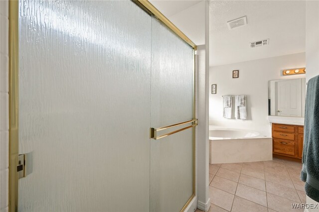 full bath with tile patterned floors, visible vents, a stall shower, vanity, and a bath