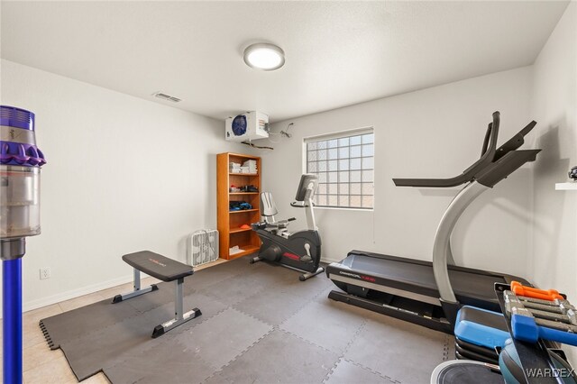 exercise area with visible vents and baseboards