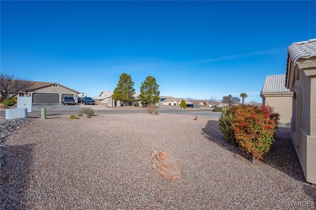 view of yard featuring a residential view