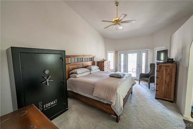 bedroom with access to exterior, french doors, light colored carpet, and ceiling fan