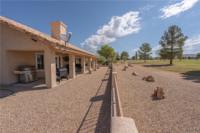 surrounding community featuring a patio area