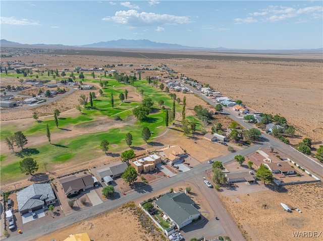 aerial view with a residential view, a mountain view, and golf course view