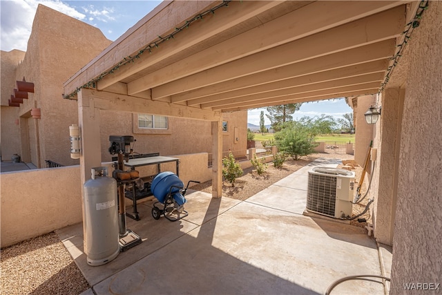 view of patio with cooling unit and a fenced backyard