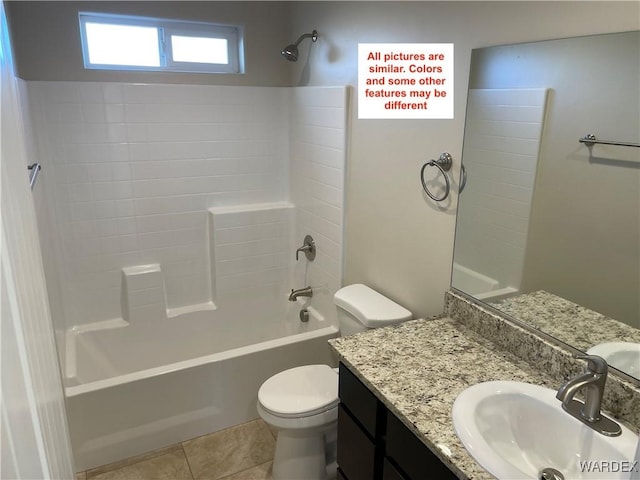 bathroom featuring toilet, tile patterned flooring, washtub / shower combination, and vanity