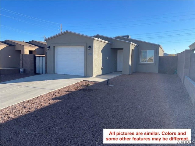 view of front of property with concrete driveway, fence, an attached garage, and stucco siding