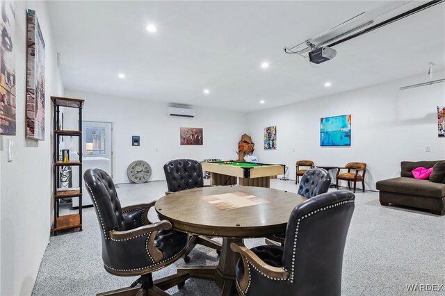 dining space featuring light speckled floor, an AC wall unit, and recessed lighting