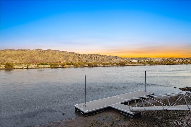 view of dock featuring a water and mountain view