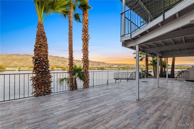 deck featuring a water and mountain view