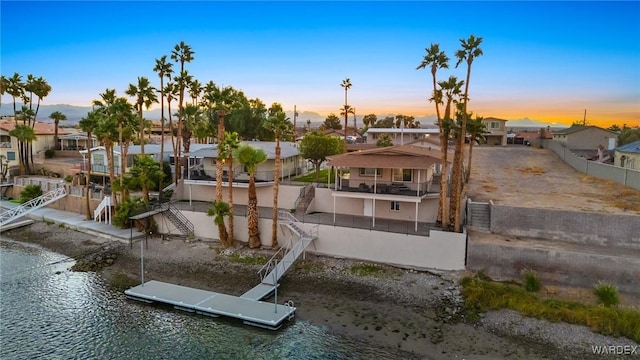 exterior space featuring a water view and a residential view