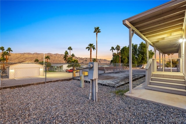 view of yard with fence and a mountain view