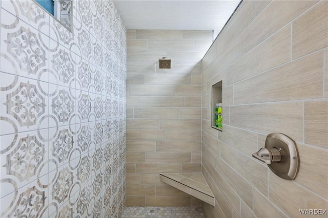 full bath with tiled shower