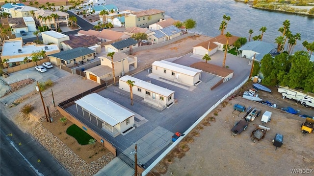 birds eye view of property featuring a water view and a residential view