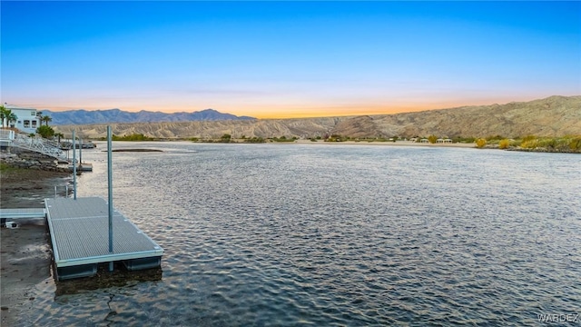 property view of water featuring a mountain view and a floating dock