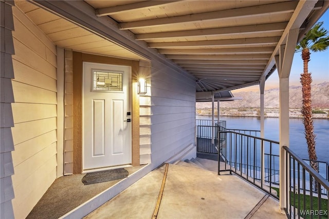 doorway to property featuring a water view