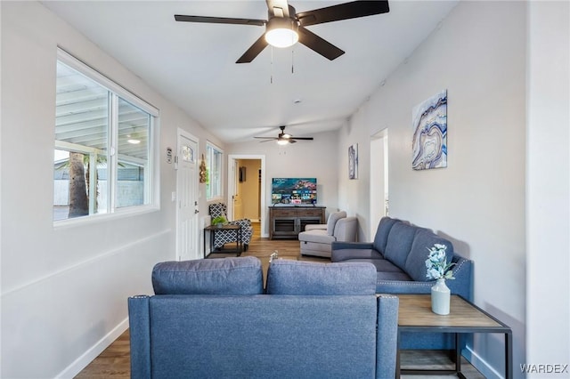 living room with dark wood finished floors and baseboards