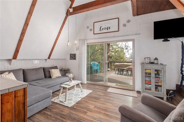 living room with beamed ceiling, dark wood-style floors, and high vaulted ceiling