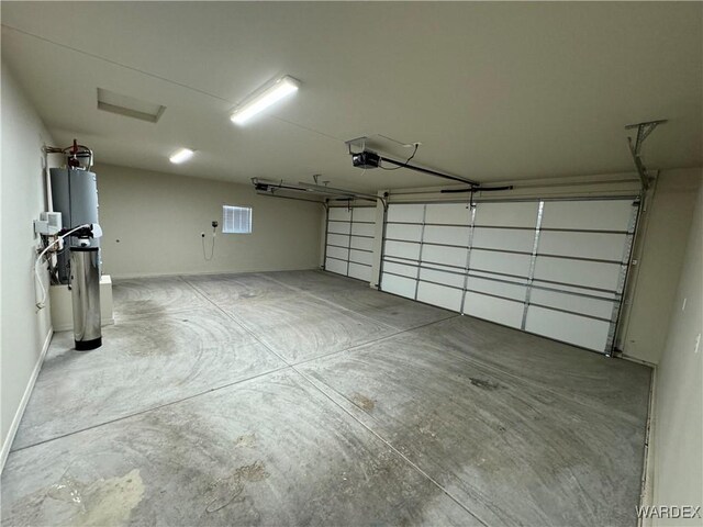 garage with baseboards and a garage door opener