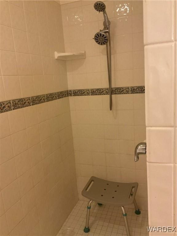 full bath with a tile shower