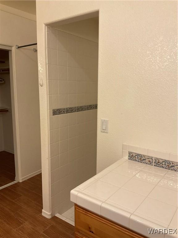 bathroom featuring wood finished floors