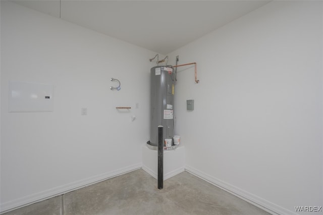 laundry room with electric water heater and baseboards