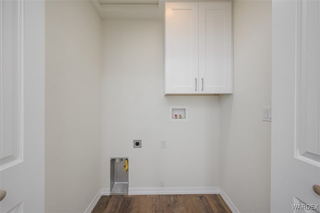 clothes washing area with cabinet space, baseboards, dark wood-style floors, hookup for a washing machine, and electric dryer hookup