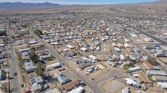 birds eye view of property with a residential view and a mountain view