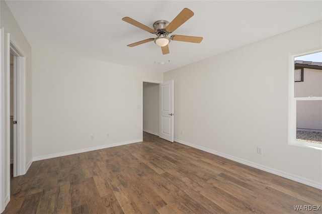 unfurnished bedroom with ceiling fan, baseboards, and wood finished floors