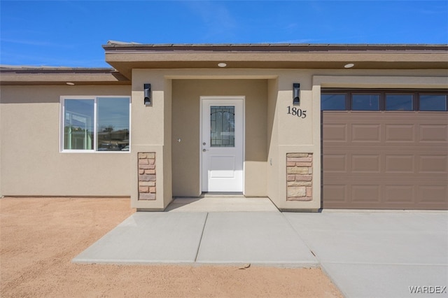 property entrance with stucco siding