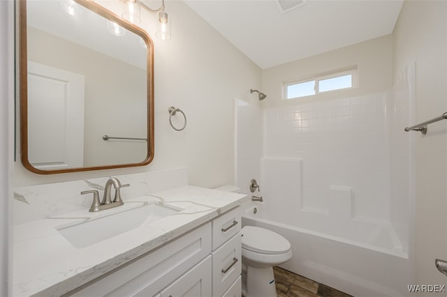 full bathroom featuring visible vents, shower / bathtub combination, vanity, and toilet