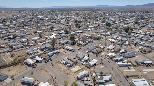 drone / aerial view featuring a residential view and a mountain view