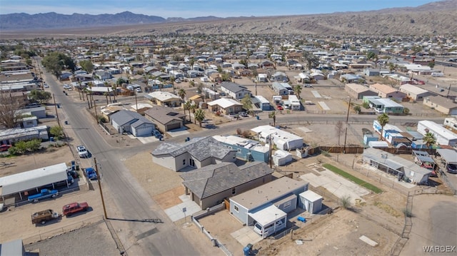 drone / aerial view featuring a residential view and a mountain view