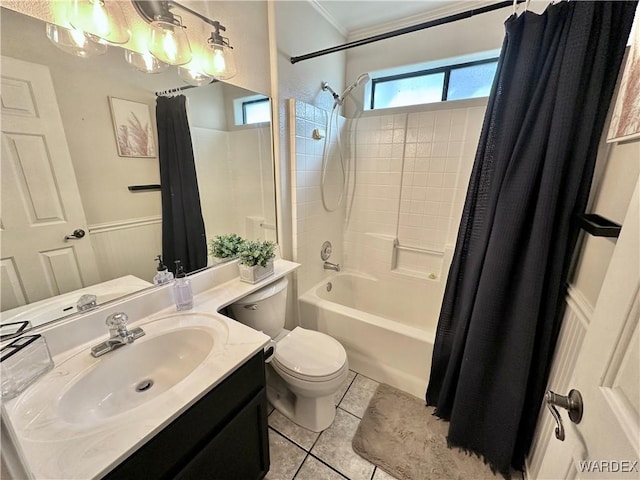 bathroom with toilet, a wainscoted wall, tile patterned flooring, shower / bath combination with curtain, and vanity