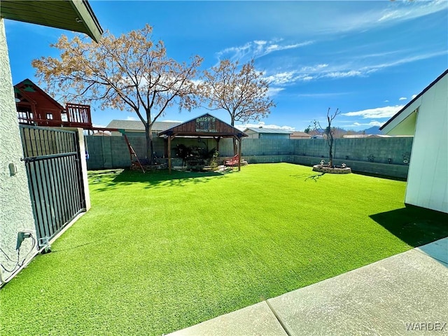 view of yard with a gazebo and a fenced backyard