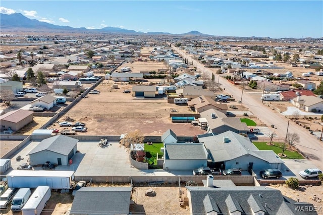 birds eye view of property with a residential view and a mountain view