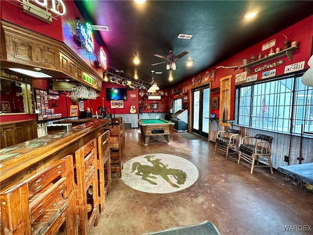 playroom with a dry bar, billiards, visible vents, a ceiling fan, and concrete flooring