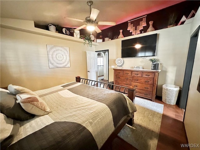 bedroom with ceiling fan and wood finished floors