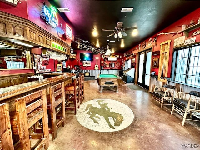 recreation room with a dry bar, visible vents, concrete flooring, and pool table