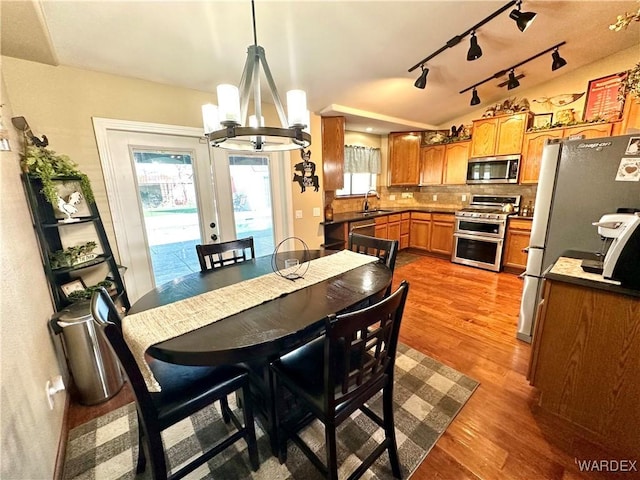 dining room with an inviting chandelier and wood finished floors