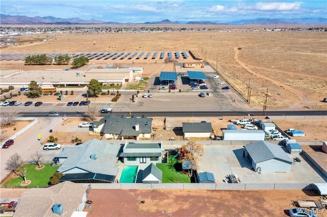 drone / aerial view with a mountain view and view of desert