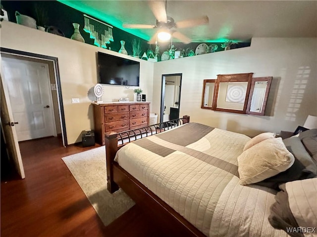 bedroom featuring wood finished floors and a ceiling fan