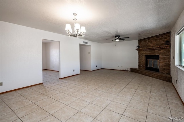 unfurnished living room featuring visible vents, a textured ceiling, light tile patterned flooring, and a fireplace