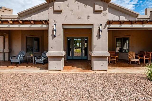 property entrance with a patio