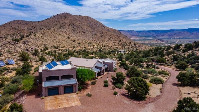 birds eye view of property featuring a mountain view